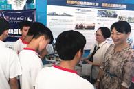 教育厅领导肯定我校提出的“与企业共建命运共同体”的做法——我校亮相广西2018年职业教育活动周